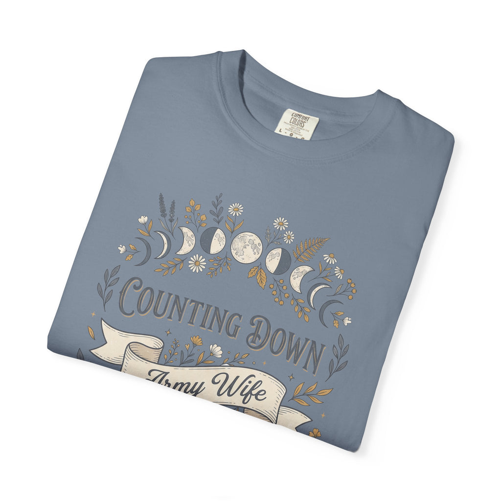 Light blue crewneck T-shirt with floral crescent 'Counting Down' and 'Army Wife' graphic.
