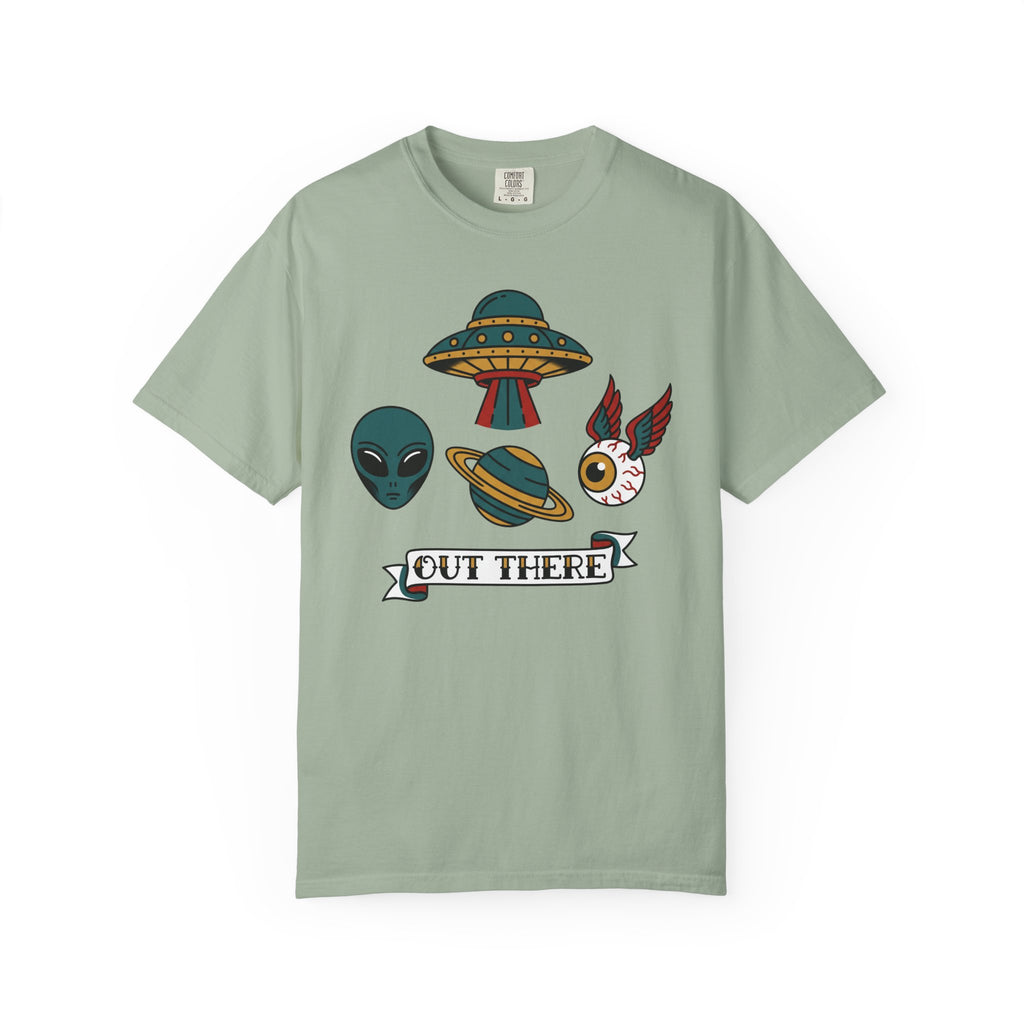 Light sage T-shirt with alien, UFO, and “OUT THERE” banner graphic at center