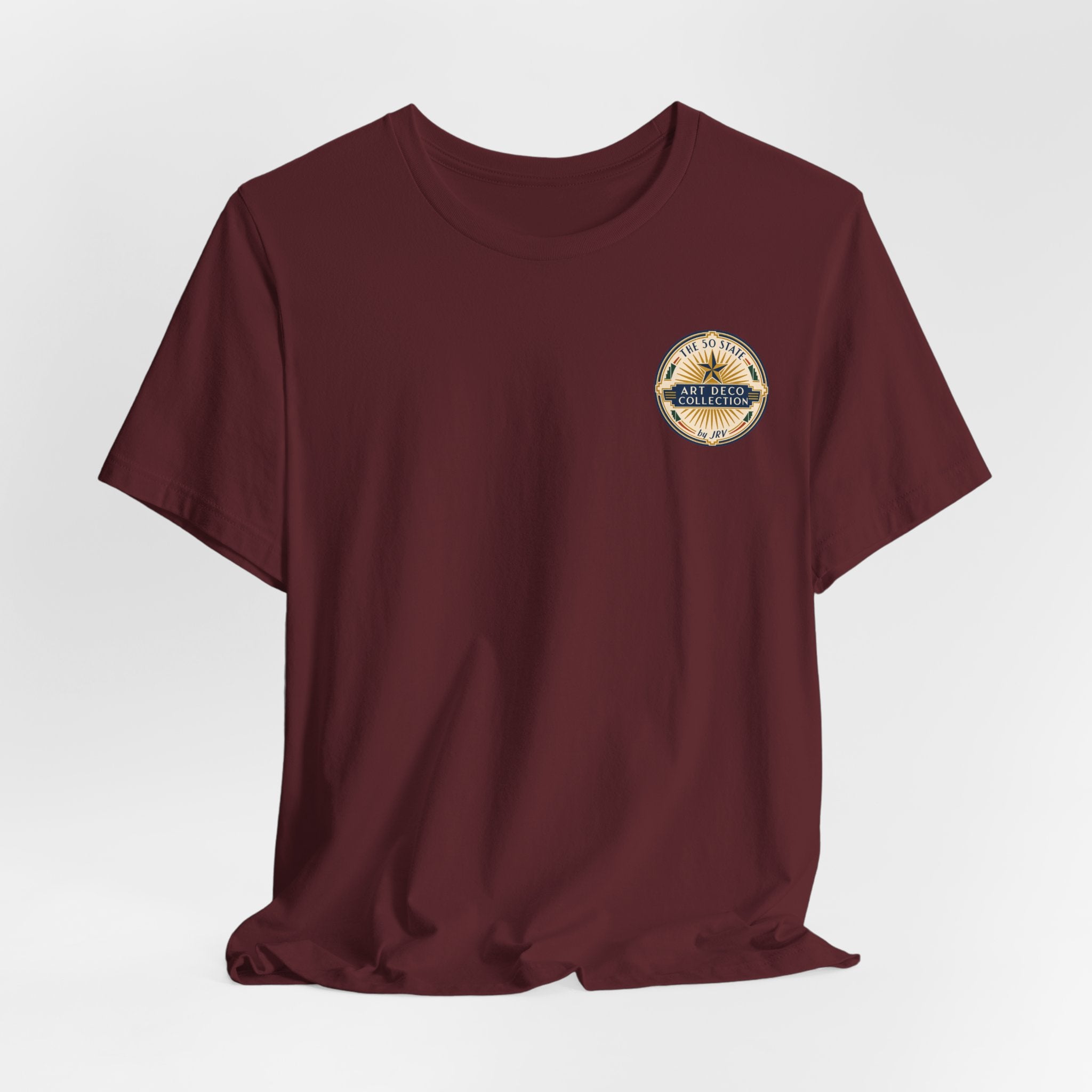 Folded maroon short-sleeve T-shirt with round chest logo on upper right