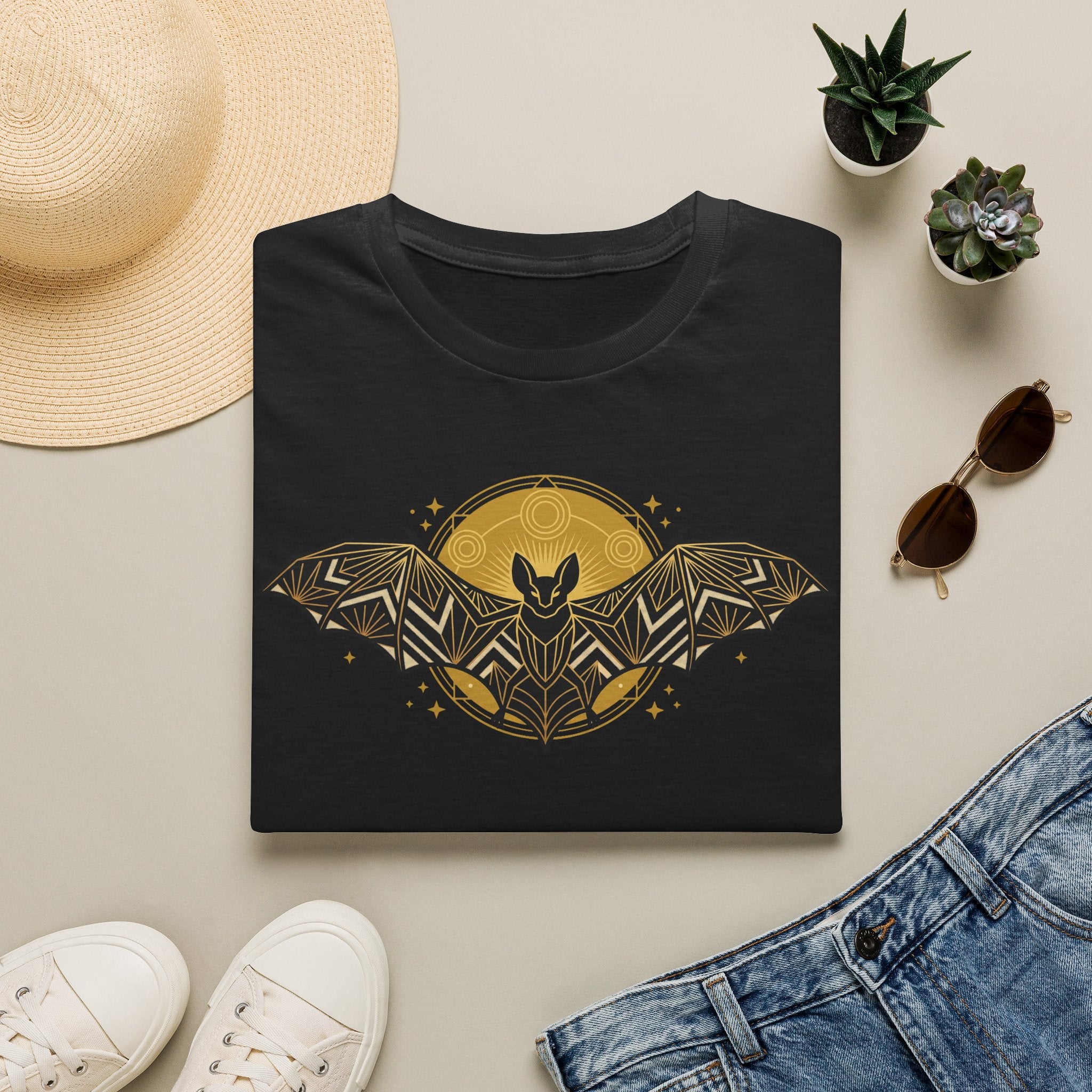 Black T-shirt with gold geometric bat and moon graphic
