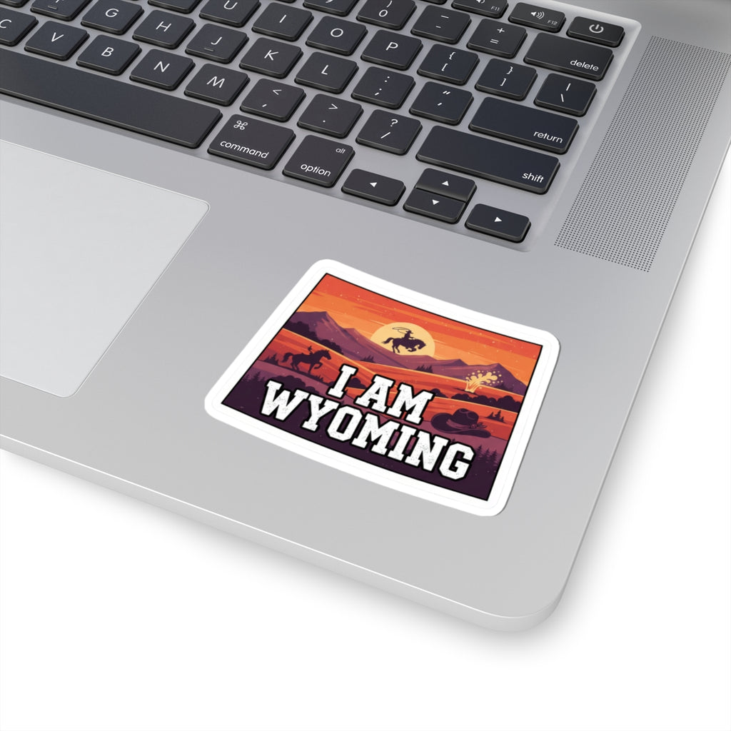 I Am Wyoming sticker on laptop, white border with mountain sunset and buffalo rider.