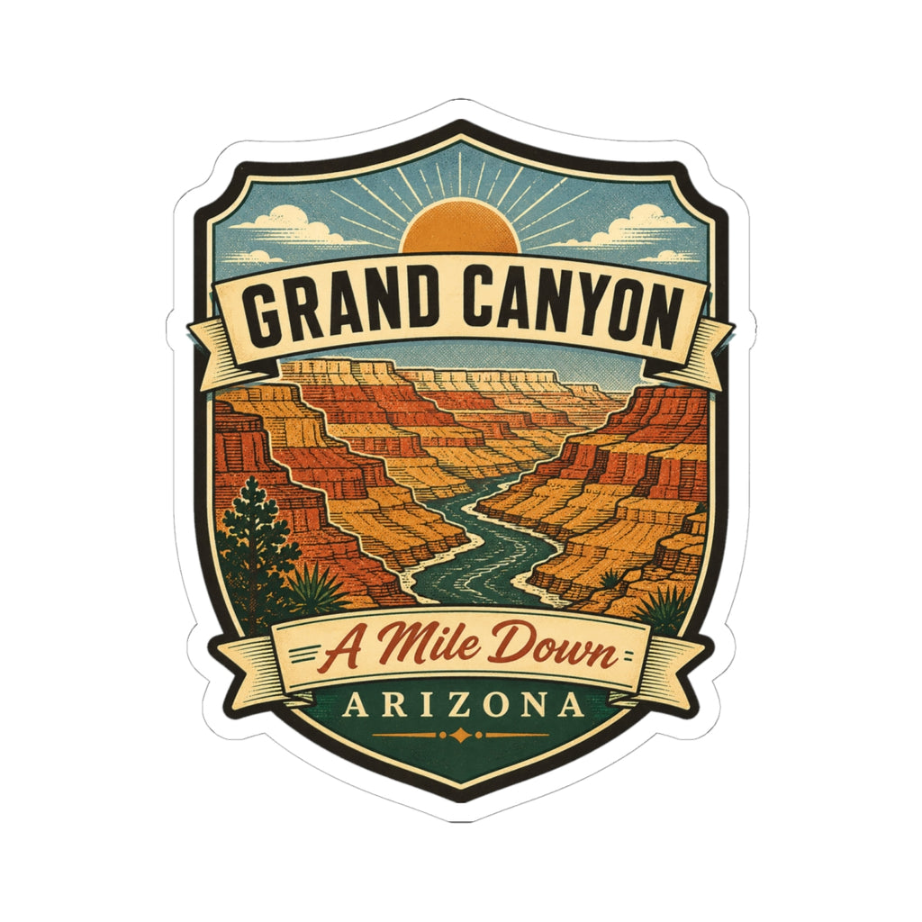Shield-shaped travel sticker with desert canyon illustration, “GRAND CANYON,” “A Mile Down,” “ARIZONA.”