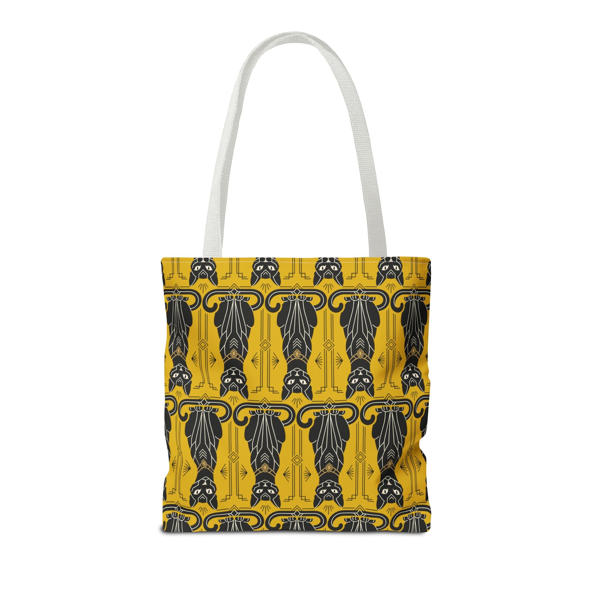 Yellow tote bag with repeating black cat pattern and navy swirls, white handles front view.