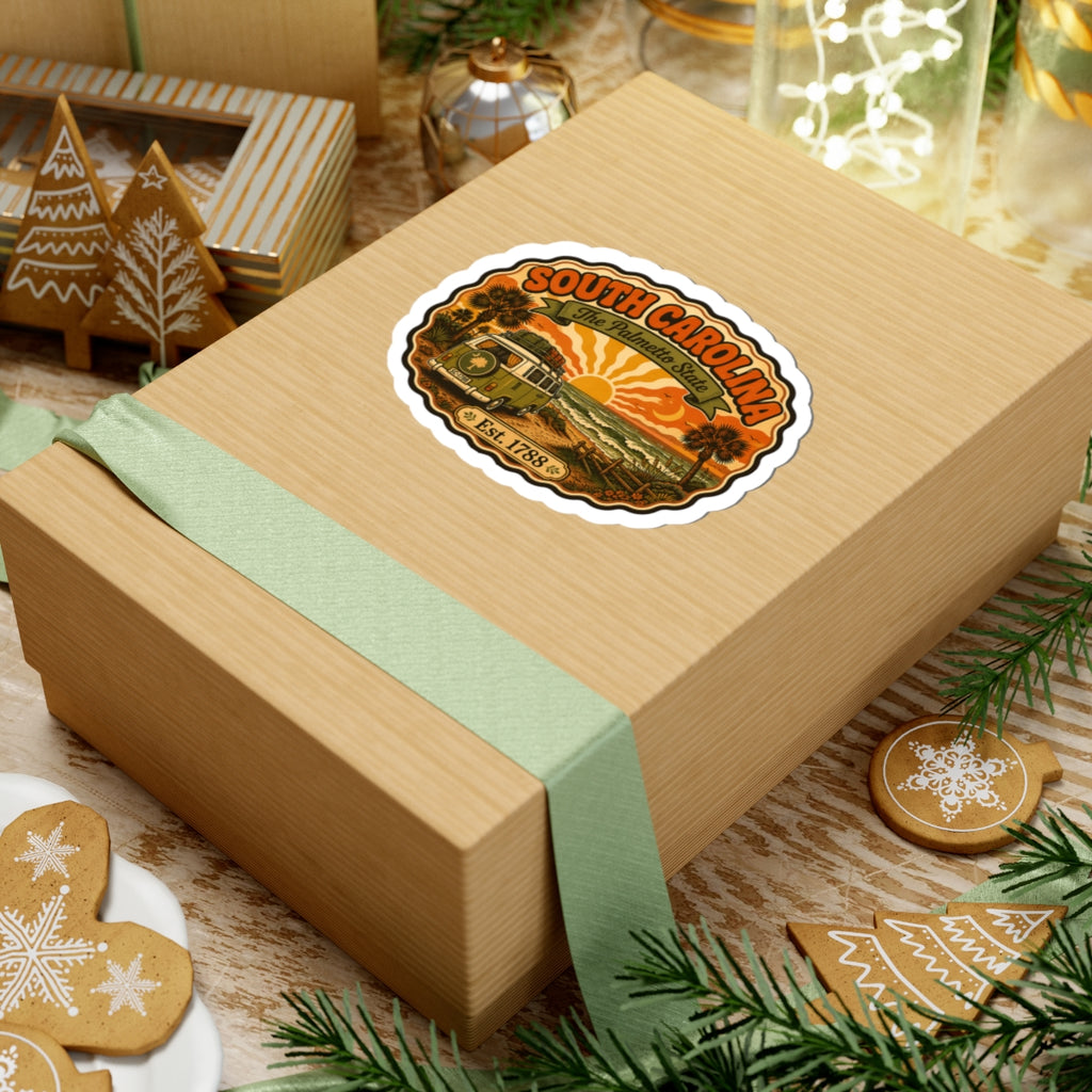 Sticker seal on a cardboard gift box: South Carolina with camper, palms, and Est. 1788.