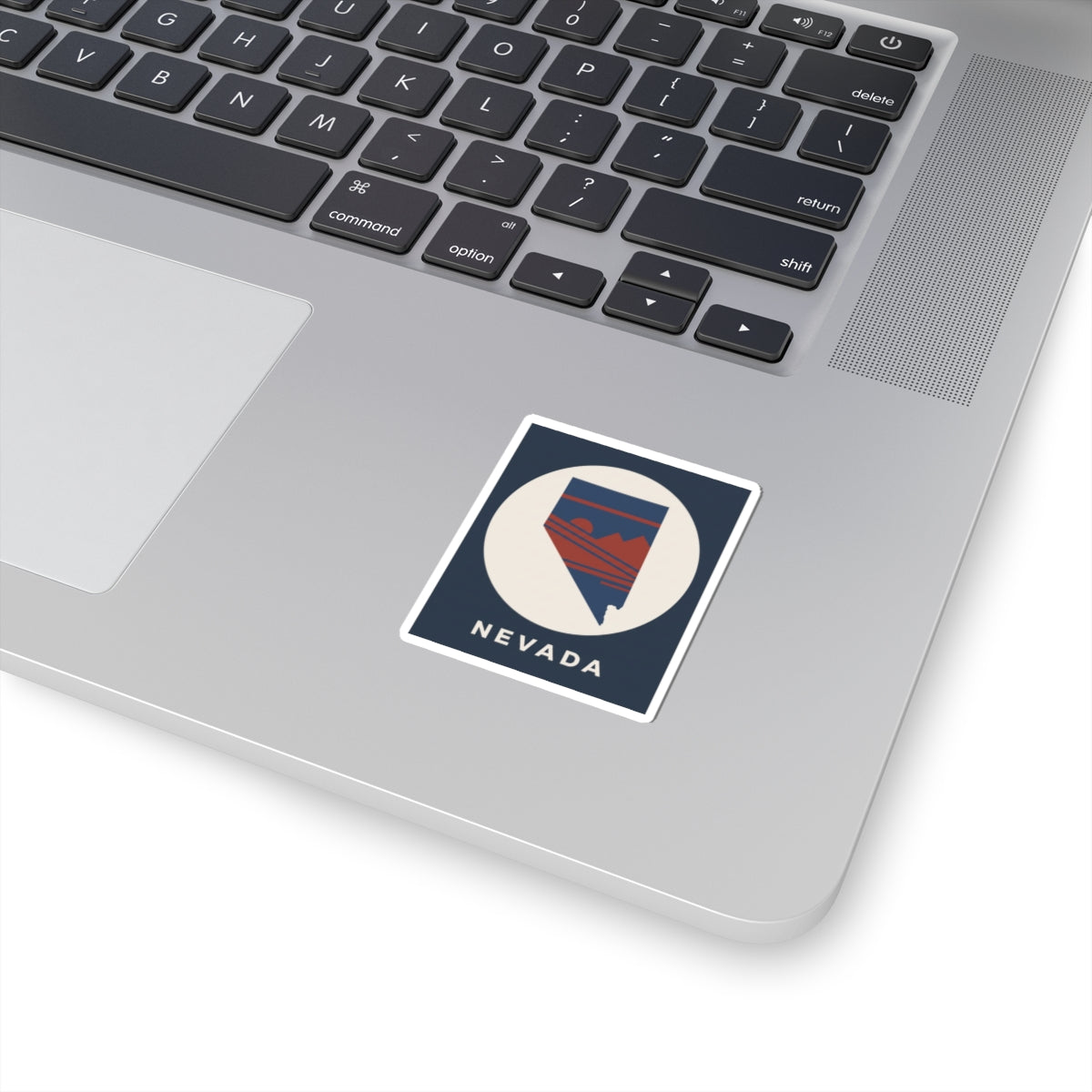 Square Nevada sticker with blue mountain badge and white border, 'NEVADA' text