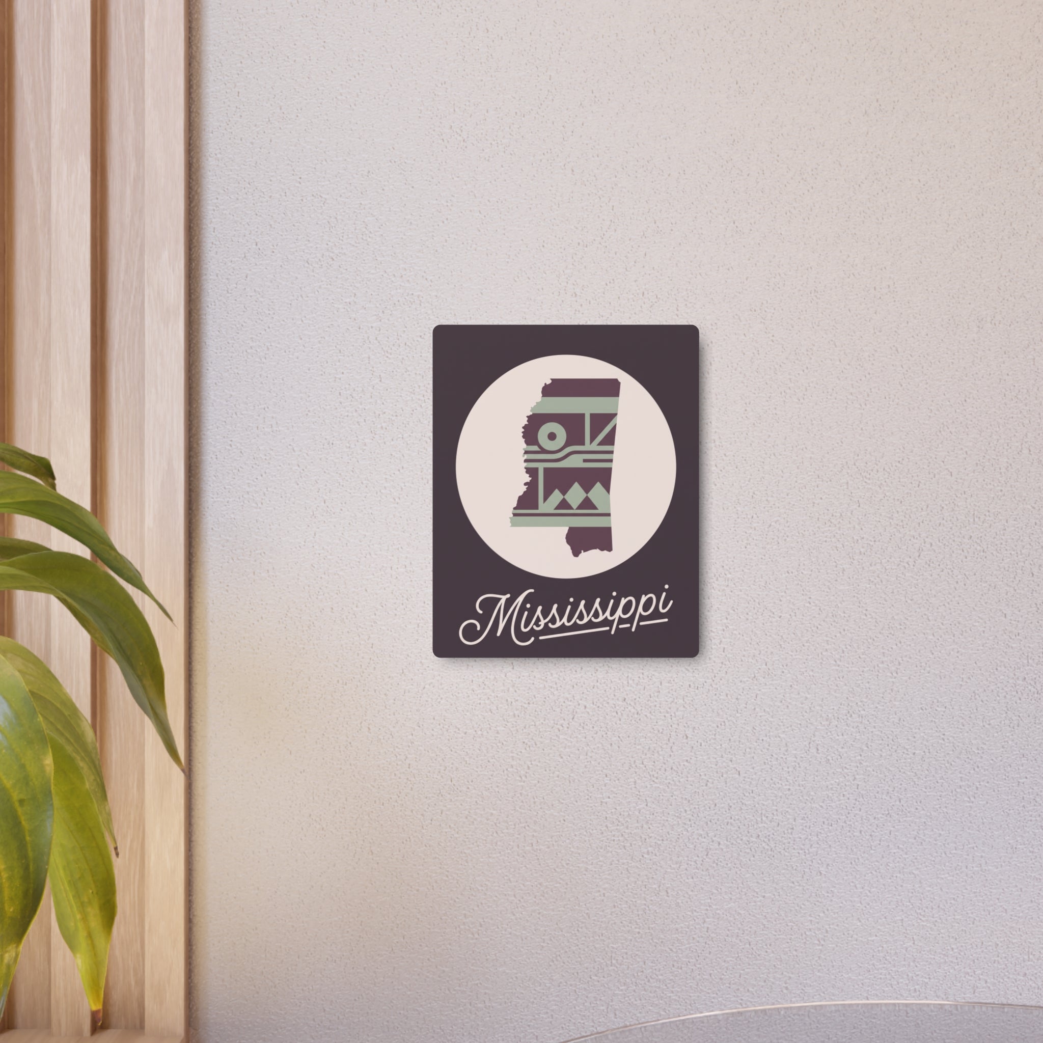 Mounted Mississippi metal wall art sign with circular silhouette and plum-and-sage southwest design