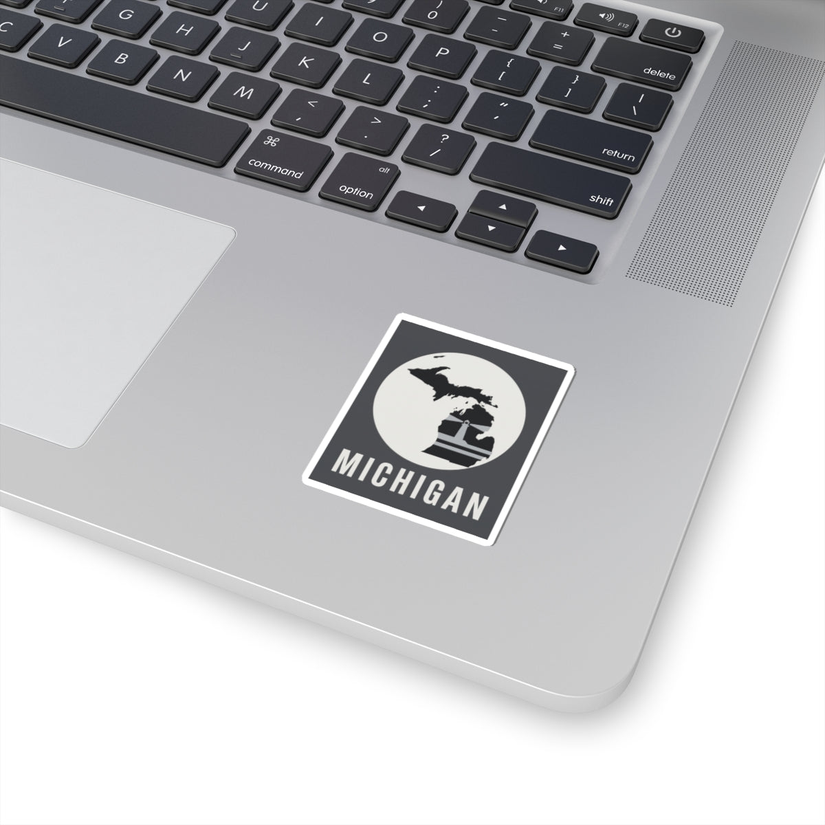 Michigan State silhouette sticker with black horse icon and MICHIGAN text, white border