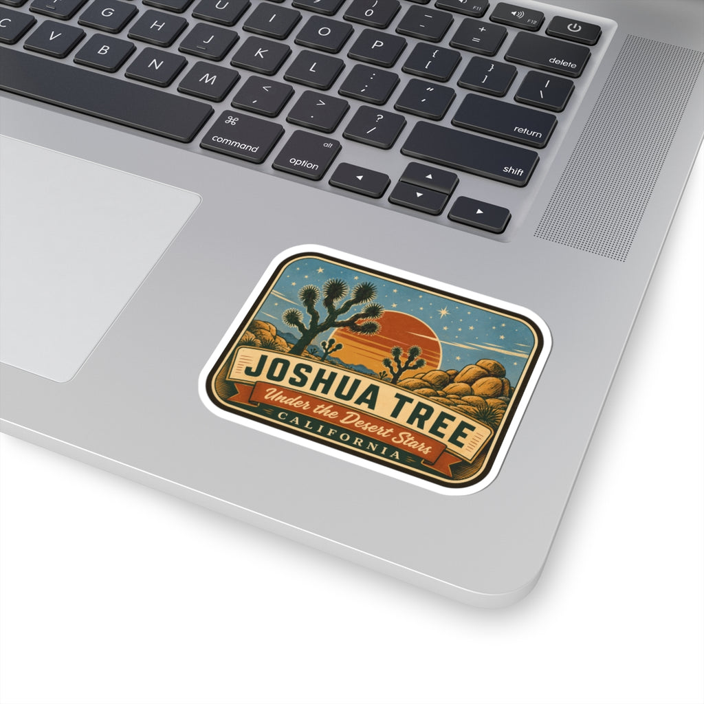 Joshua Tree sticker on a laptop keyboard with desert stars and “California” banner design.