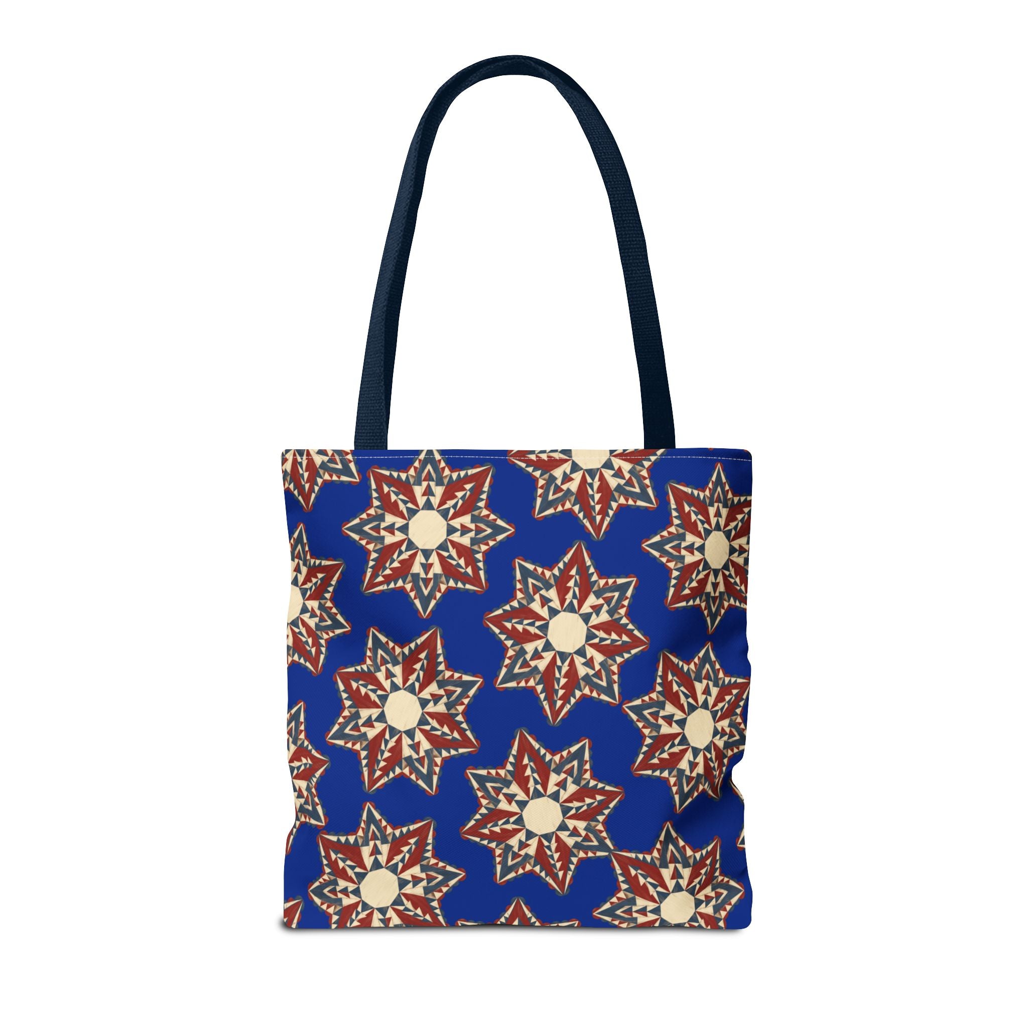 Navy tote bag with red and cream starburst floral pattern, front view with top handles.
