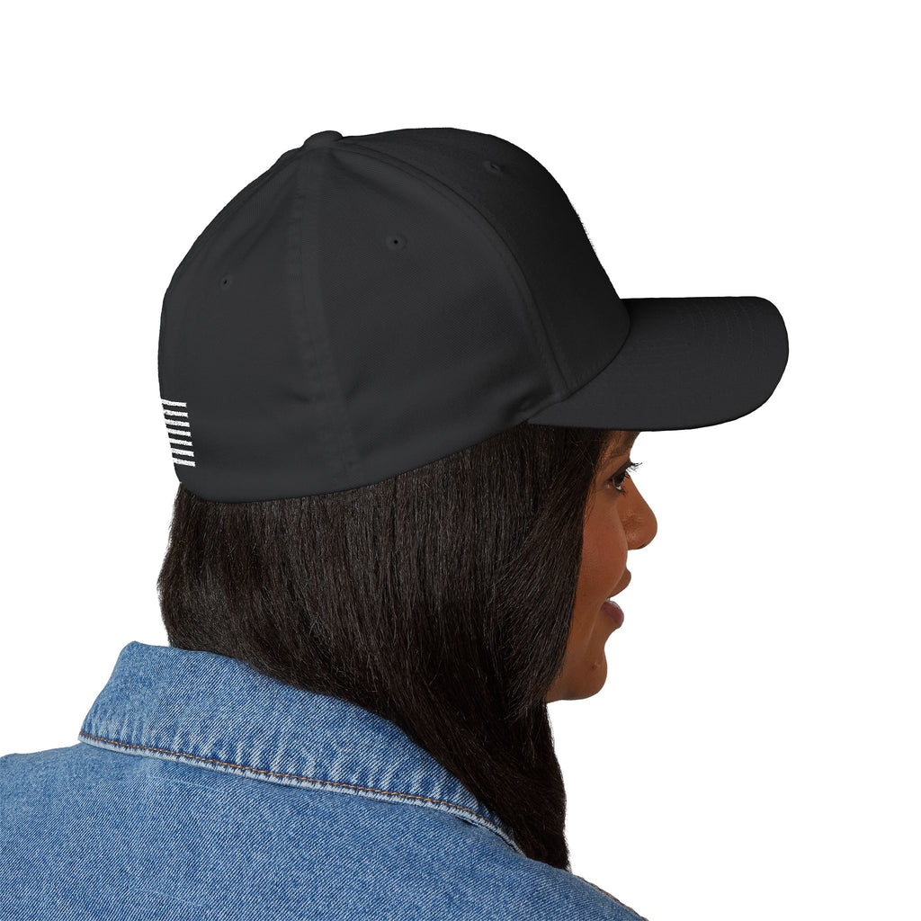 Black baseball cap side view with small white striped emblem