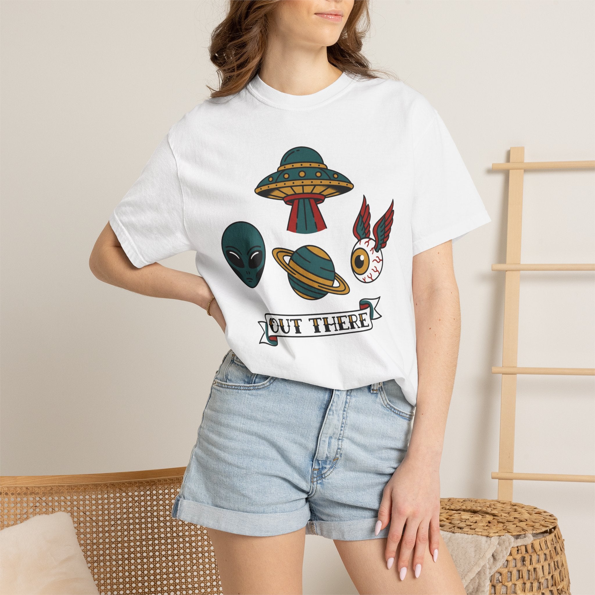 White alien and UFO patchwork graphic T-shirt with “OUT THERE” label on front