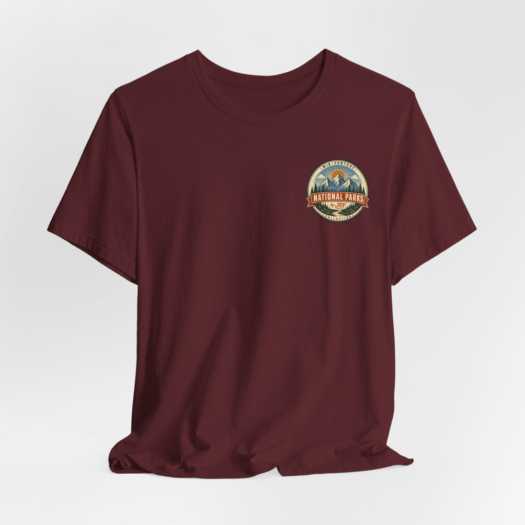 Maroon T-shirt with small circular Yellowstone National Park style emblem on chest
