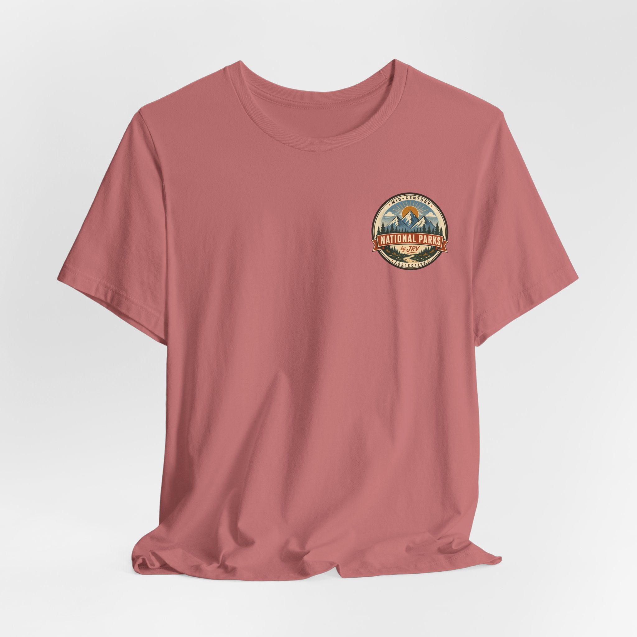 Dusty rose crew-neck T-shirt with small round national park badge on chest