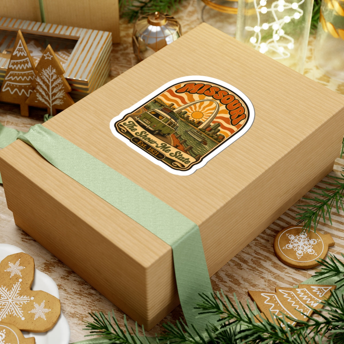 Missouri retro roadtrip sticker on a wrapped gift box, archway sun, bus and riverboat