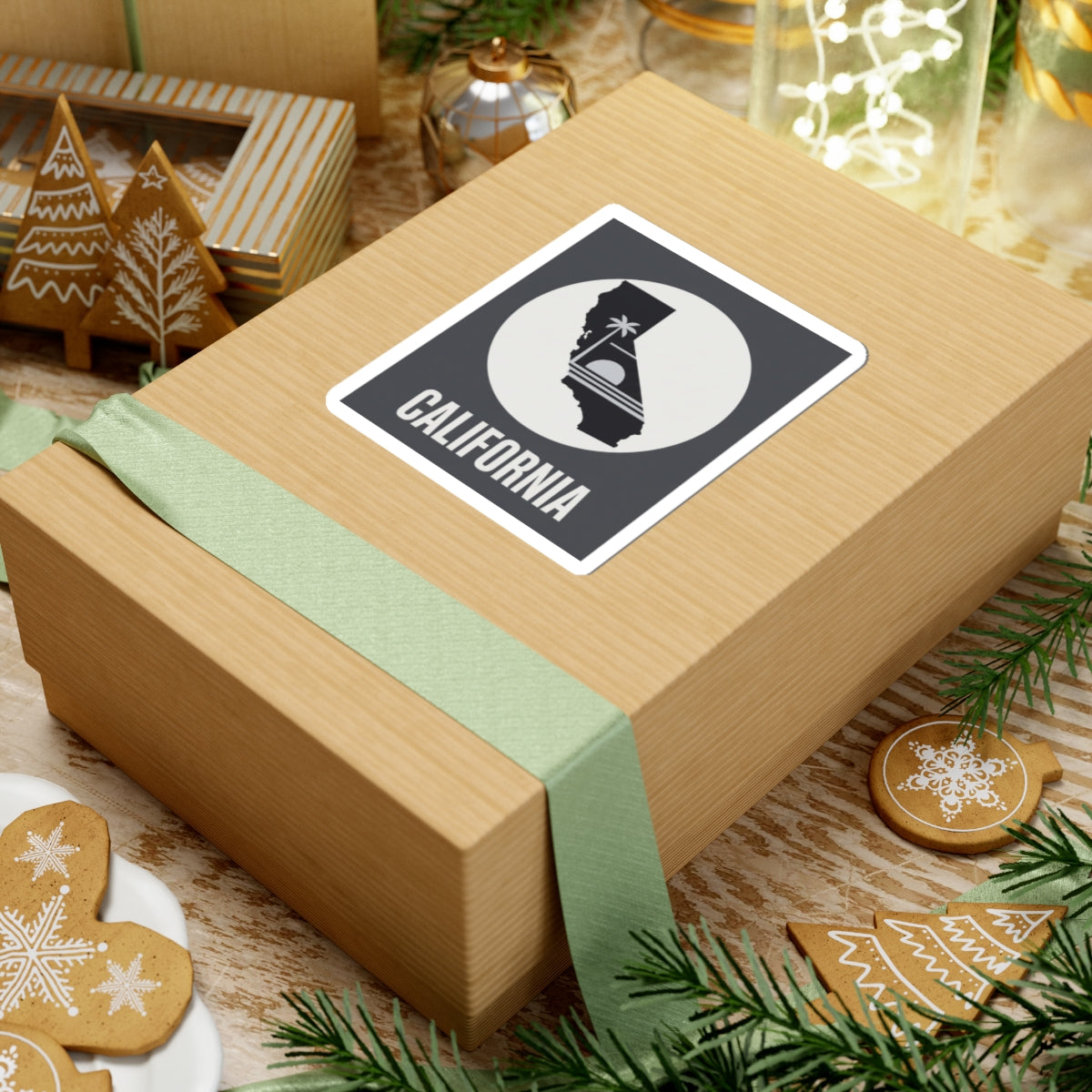 California state silhouette sticker with palm tree icon and CALIFORNIA text on wrapped gift