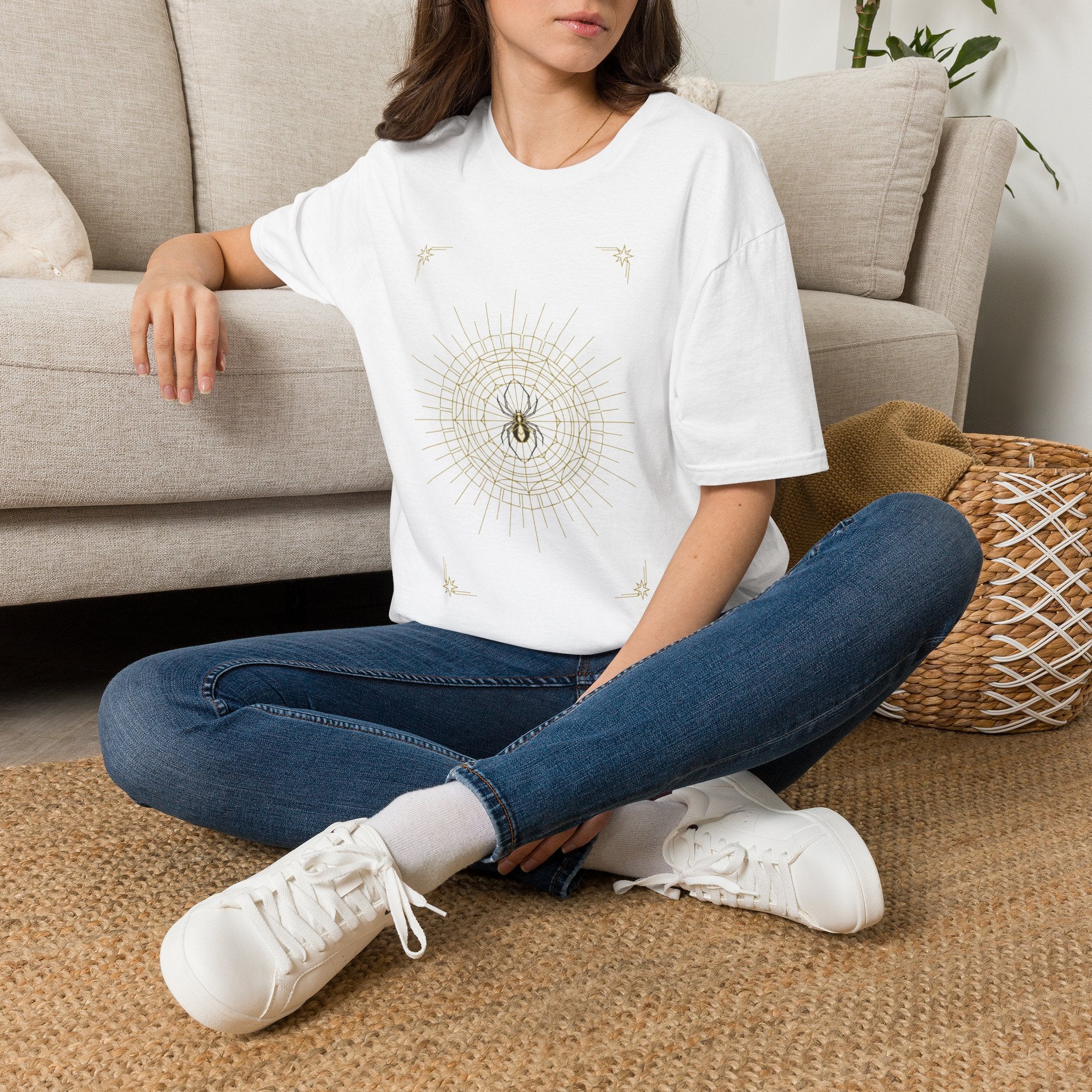 White T-shirt with gold spider web mandala and small star accents on the chest