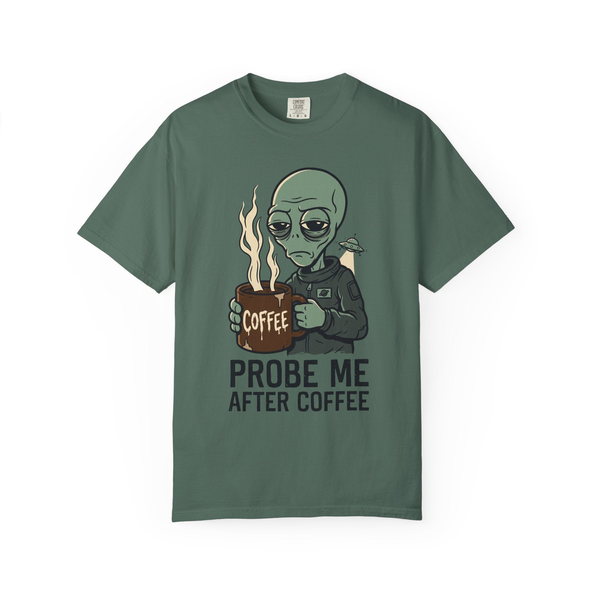 Forest green T-shirt with alien holding coffee cup graphic and 'PROBE ME AFTER COFFEE' text.