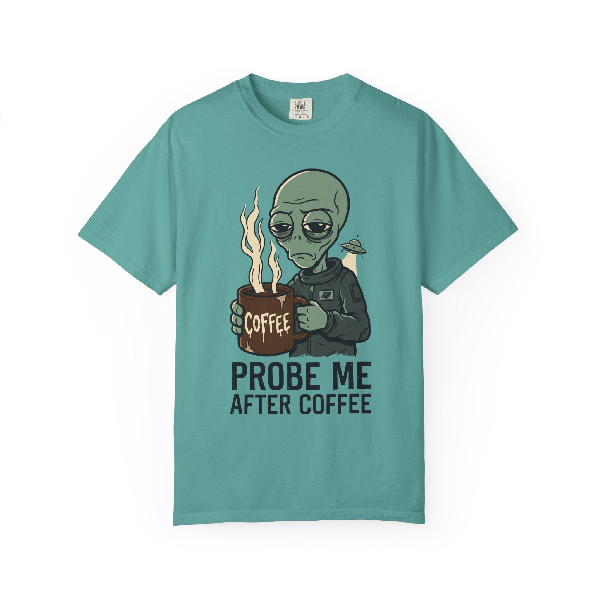 Teal T-shirt with alien holding coffee cup graphic and 'PROBE ME AFTER COFFEE' text.