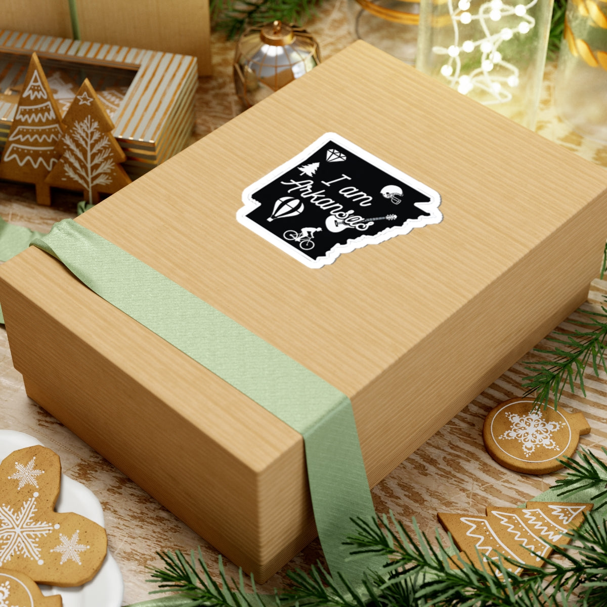 I am Arkansas sticker on a wrapped gift box, black-and-white design with icons