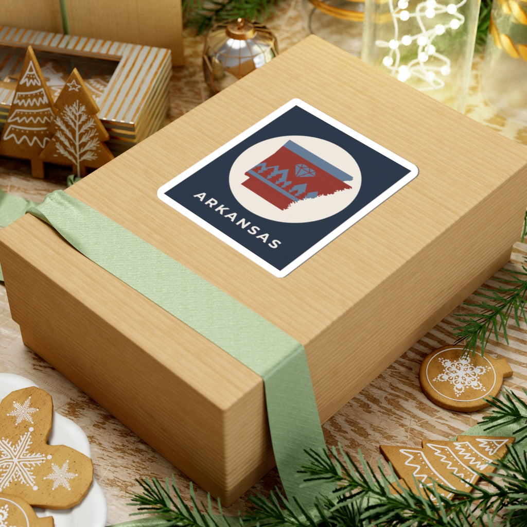 Arkansas emblem sticker on gift box, diamond icon and pine trees with ARKANSAS text
