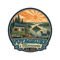 Round die-cut sticker with vintage-style green camper van, pines, lake and orange sun; Est. 1975