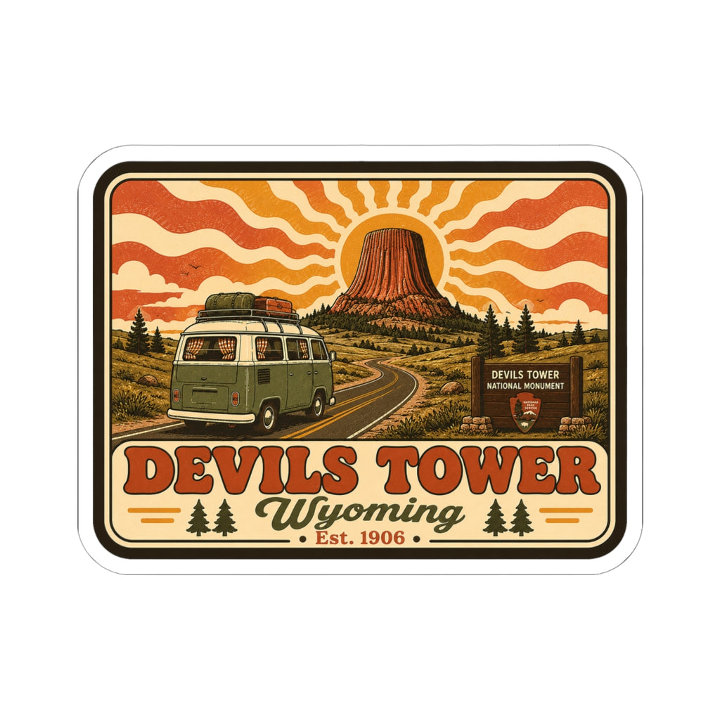 Kiss-cut sticker featuring Devil’s Tower rock, orange wave sky, and green camper van