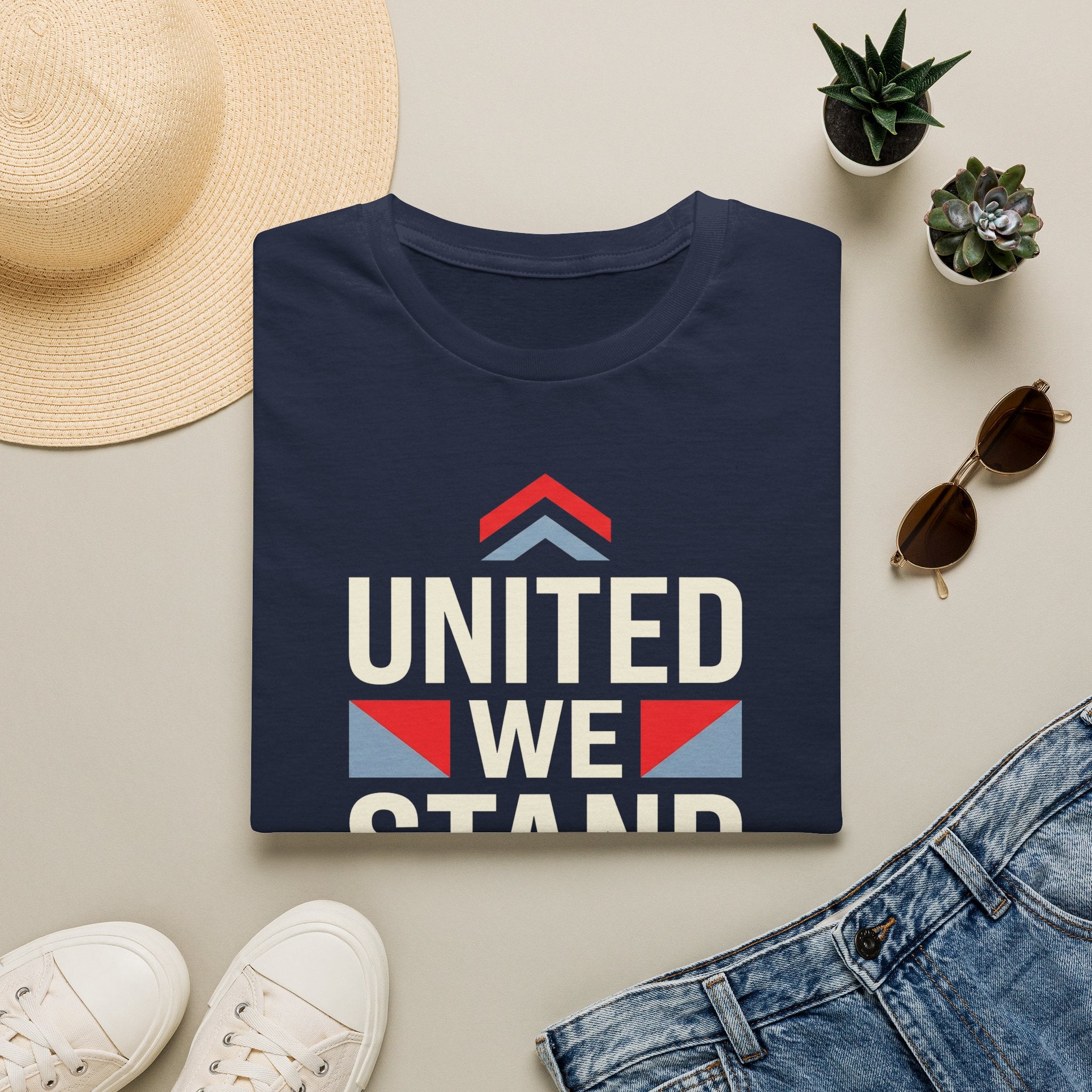 Navy crewneck T-shirt with “UNITED WE STAND” typography graphic on the front