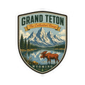 Retro-style shield travel sticker with moose, mountain peaks, water scene, and “Wyoming” at bottom.