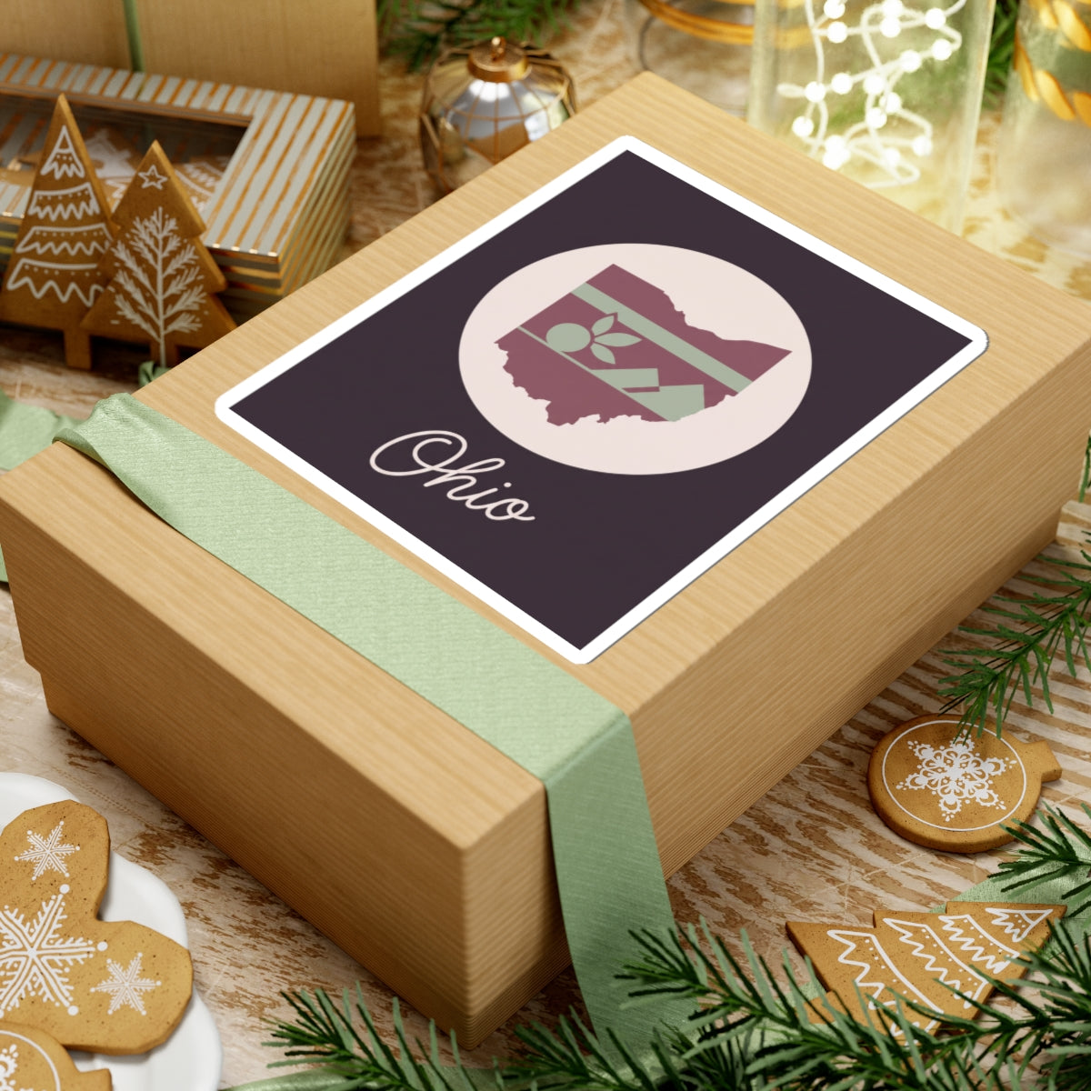 Ohio kiss-cut decal on a gift box; dark square with circular floral stripe map and “Ohio”