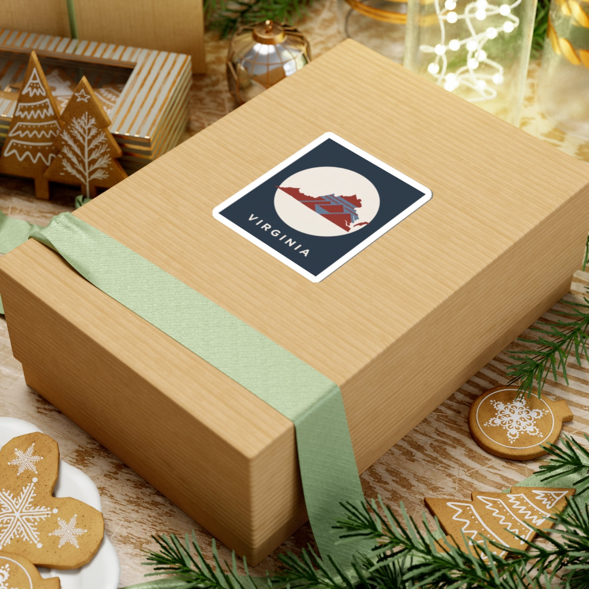 Virginia state map sticker on gift wrap: dark blue square with cream circle and red map design