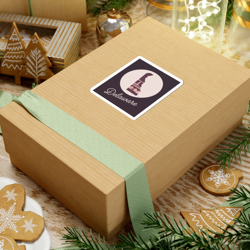 Delaware silhouette vinyl sticker on gift box, mauve lighthouse icon with 'Delaware' script