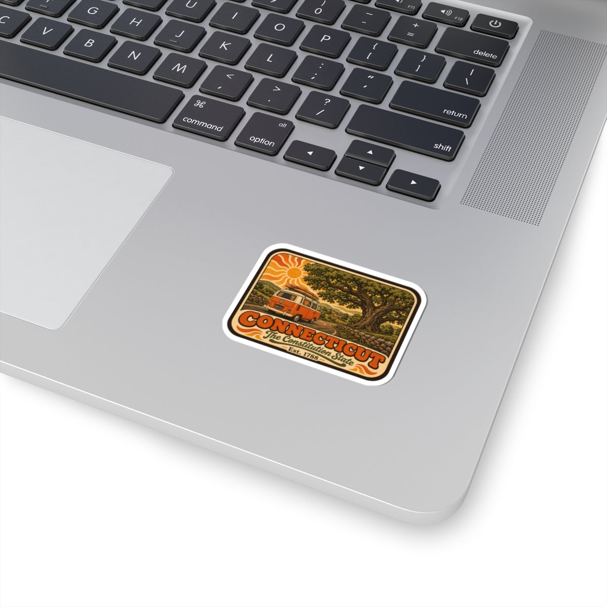 Connecticut vintage camper van sticker with orange border, on laptop
