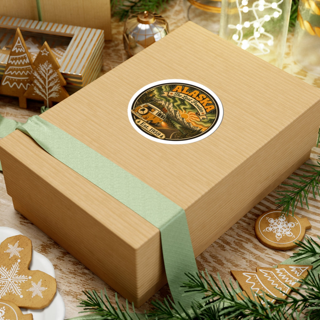 Round Alaska vintage sticker on a wrapped gift box, featuring camper van and Est. 1959