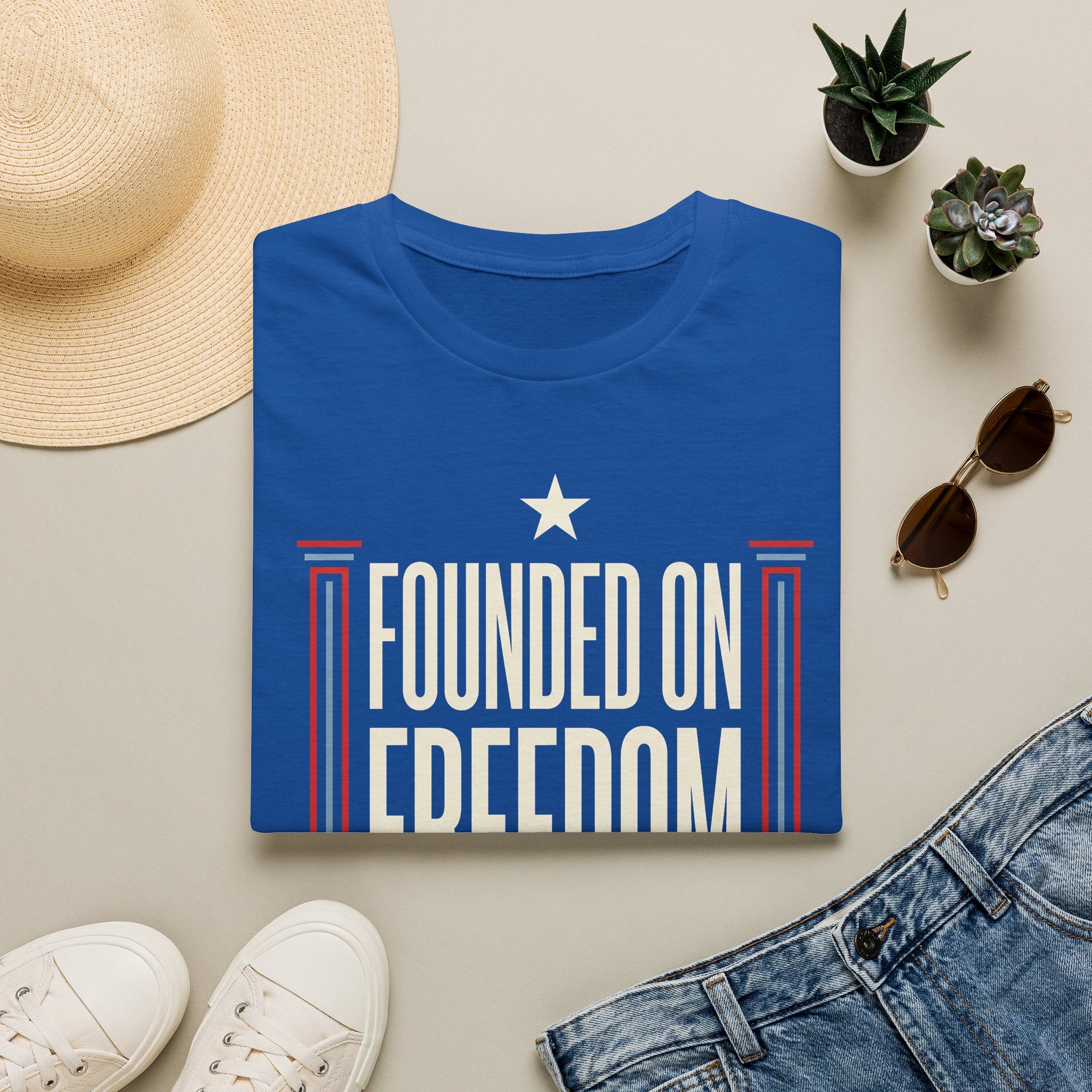Royal blue short-sleeve t-shirt with white star and "Founded on Freedom" graphic