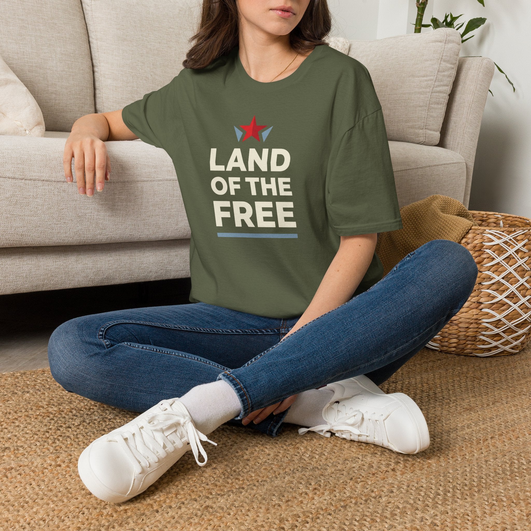 Olive green T-shirt with red star and white “LAND OF THE FREE” text, crew neck