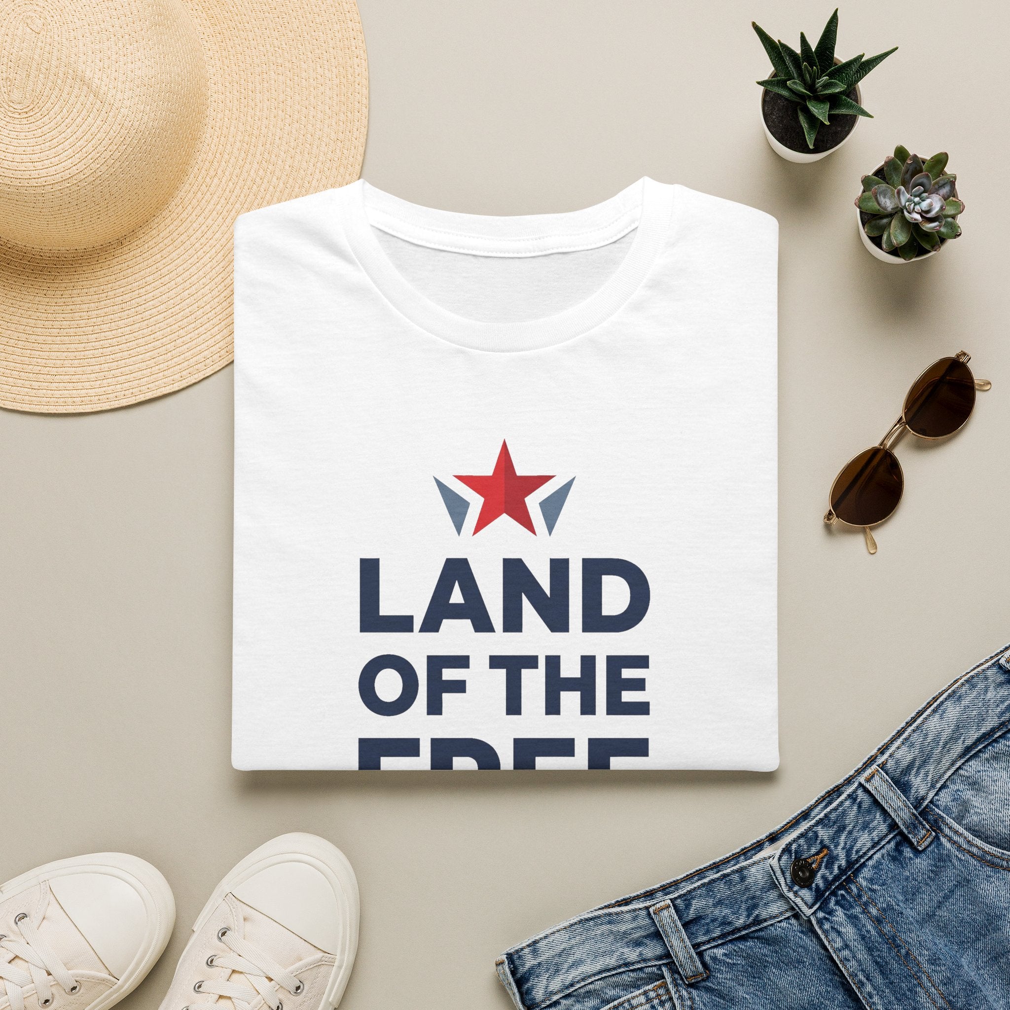 White crewneck T-shirt with red star and blue "LAND OF THE FREE" front print
