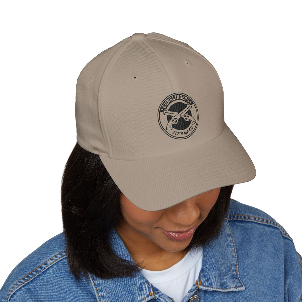 Khaki baseball cap with circular black embroidered emblem