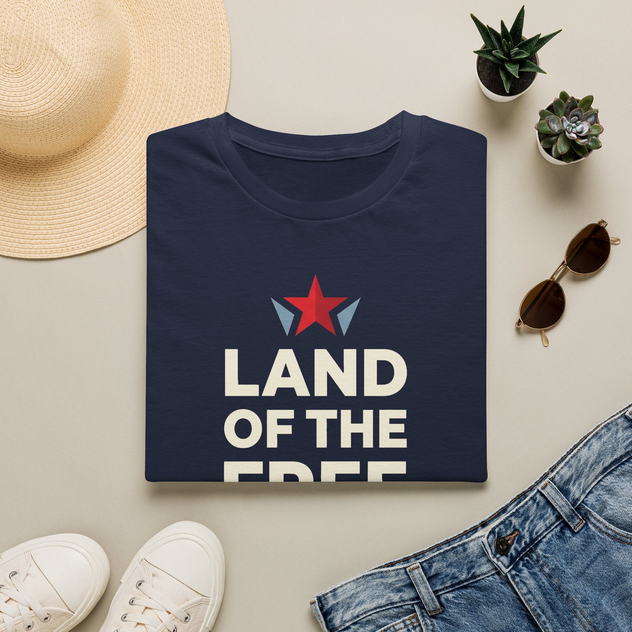 Navy T-shirt with red star graphic and bold white patriotic text, crew neck
