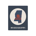 Mississippi metal art sign: square dark blue with circular silhouette and “MISSISSIPPI” text.