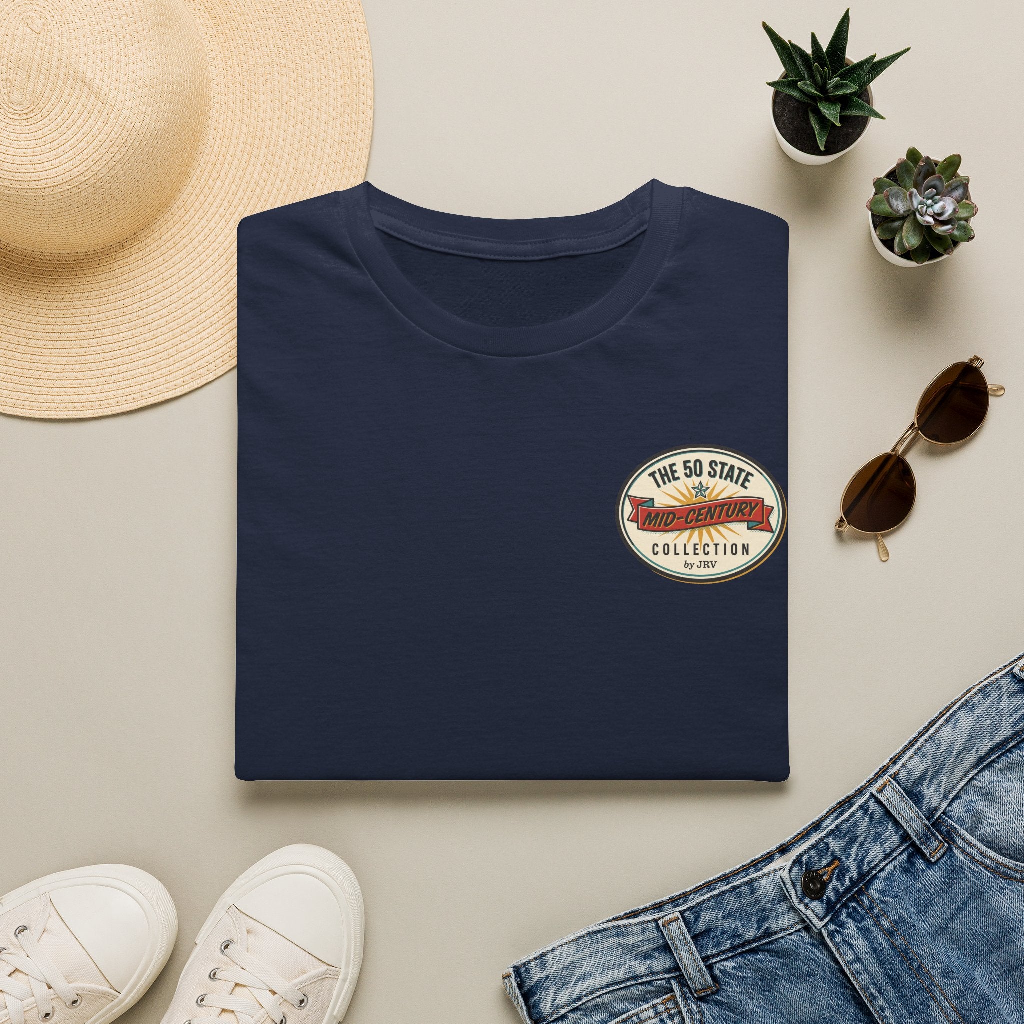Navy crew-neck T-shirt folded flat with small chest circular graphic logo