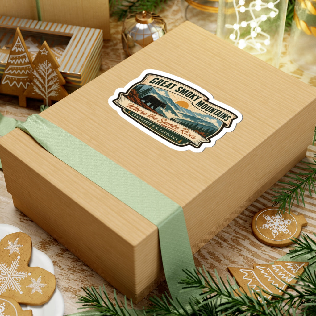 Great Smoky Mountains travel sticker on a wrapped gift, bear-and-mountains badge; “Where the Smoke Rises”