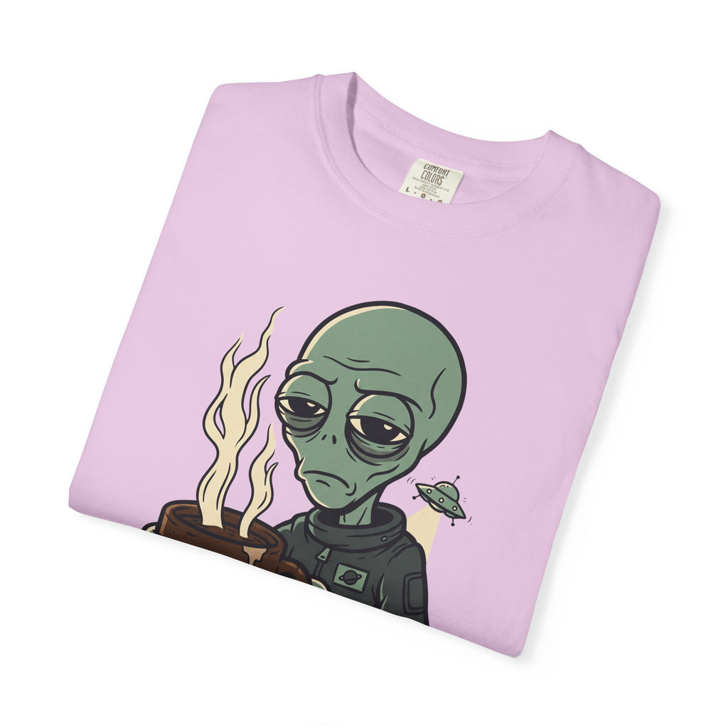 Light pink T-shirt folded, showing green alien with coffee cup and “PROBE ME” text