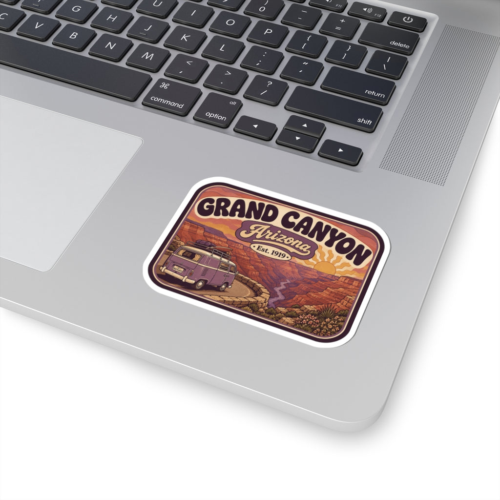 Rounded Grand Canyon sticker on laptop lid with purple camper van and "Arizona"