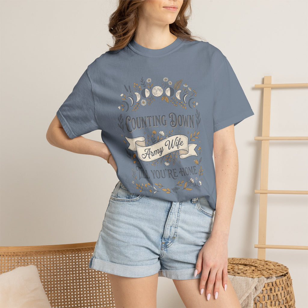 Light blue T-shirt with 'Counting Down' crescent floral graphic, worn by model.