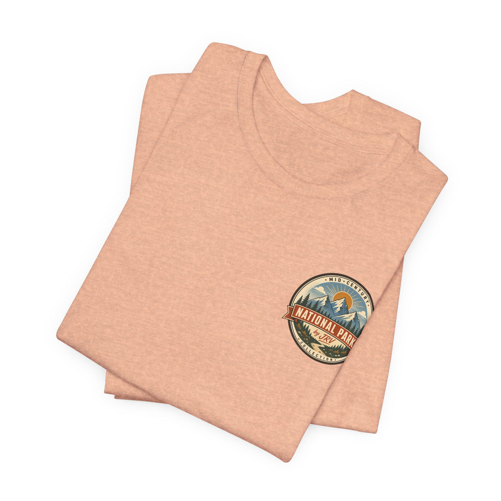 Peach crew-neck t-shirt with circular National Park emblem graphic on chest