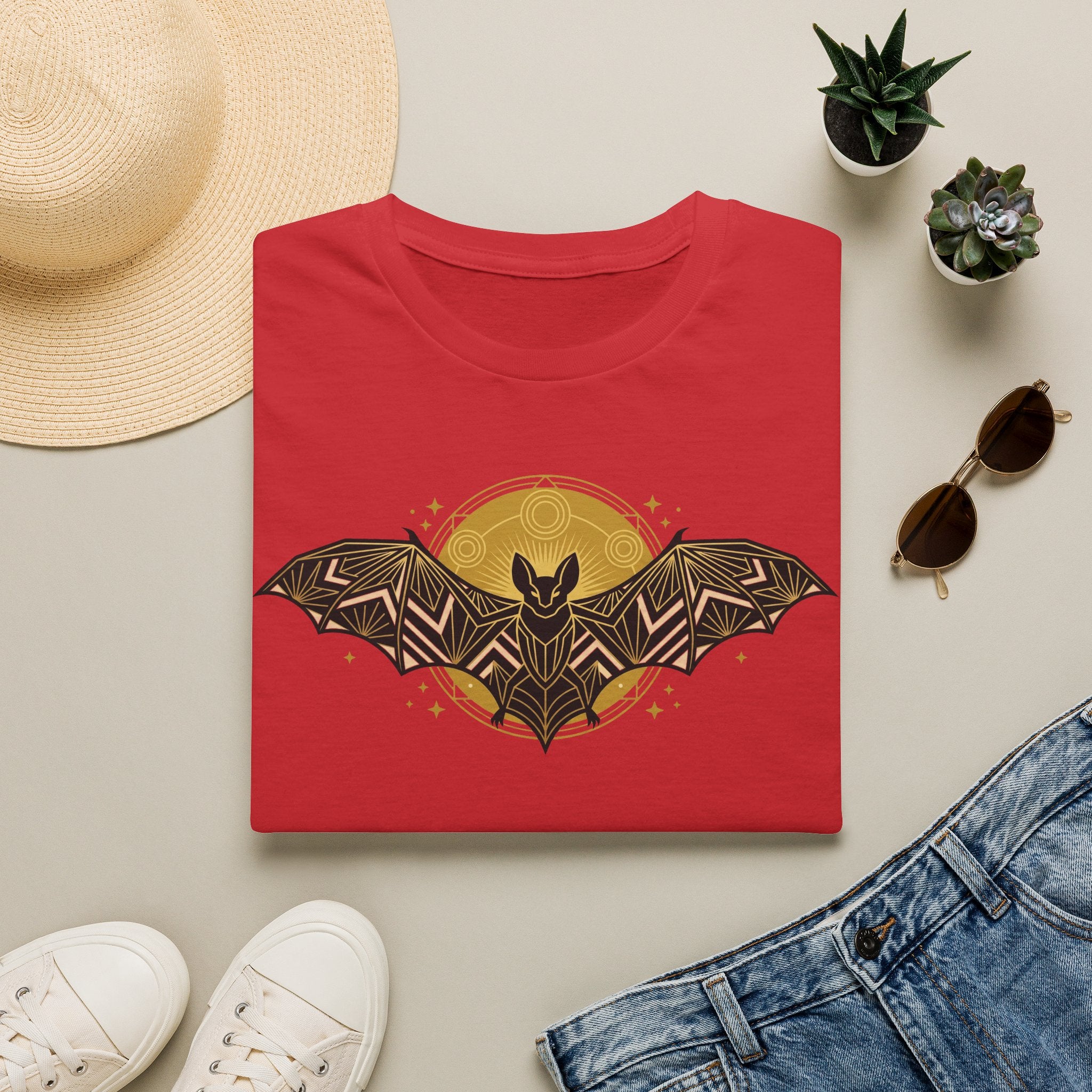 Red T-shirt with geometric bat and moon graphic at center front