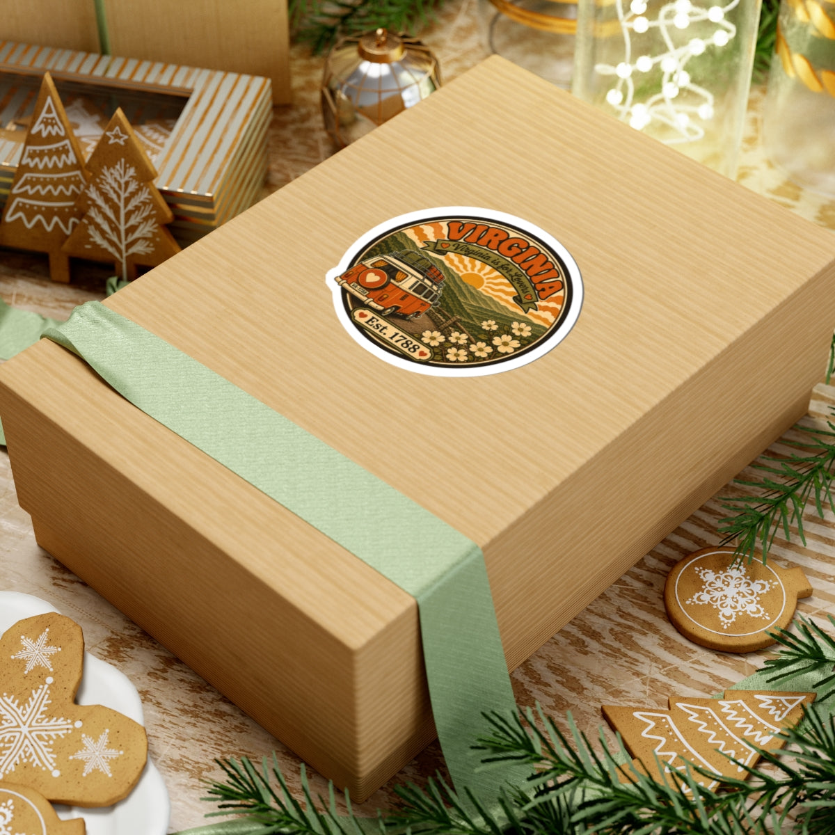 Round Virginia van sticker on a gift box with ribbon and holiday greenery