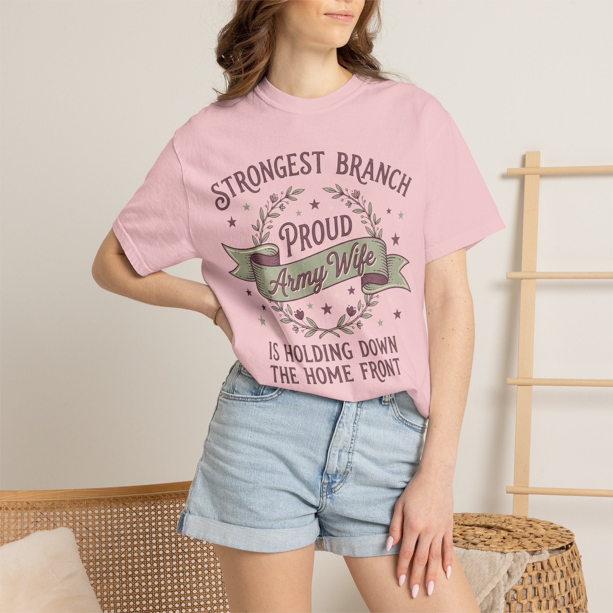 Pink t-shirt worn by woman with front 'Proud Army Wife' and branch graphic