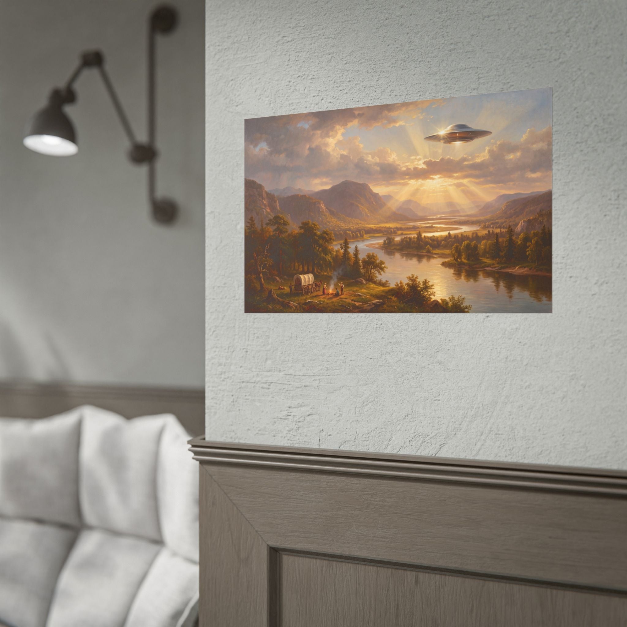 Close-up of landscape poster artwork: sunset river valley with glowing flying saucer