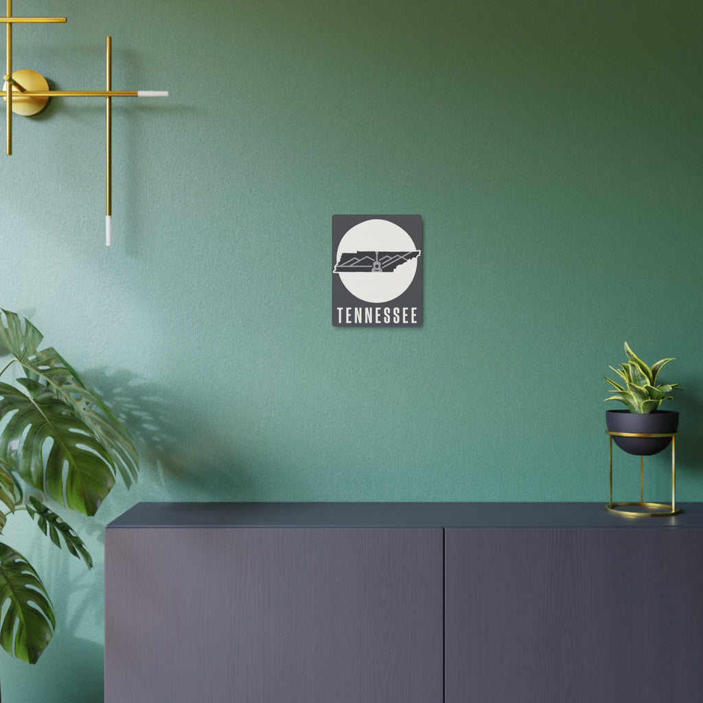 Tennessee metal wall art on green wall, dark square sign with circular guitar skyline
